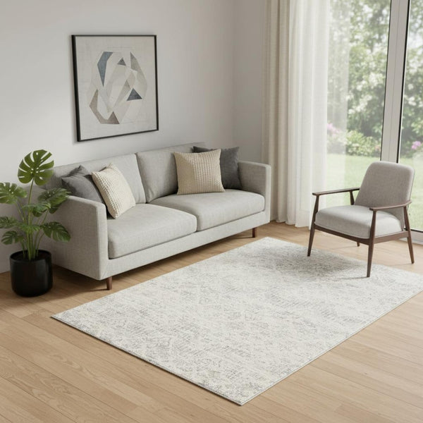 HomeRoots 5' Elegant Ivory Distressed Ikat Area Rug - Soft, Durable, and Versatile for Modern or Traditional Spaces 5' x 8' 390223