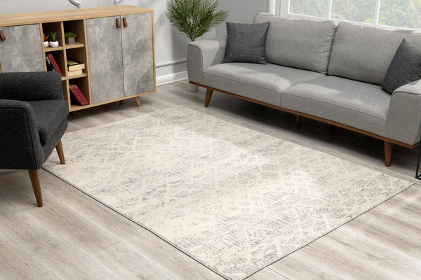 HomeRoots 5' Elegant Ivory Distressed Ikat Area Rug - Soft, Durable, and Versatile for Modern or Traditional Spaces 8' x 11' 390224