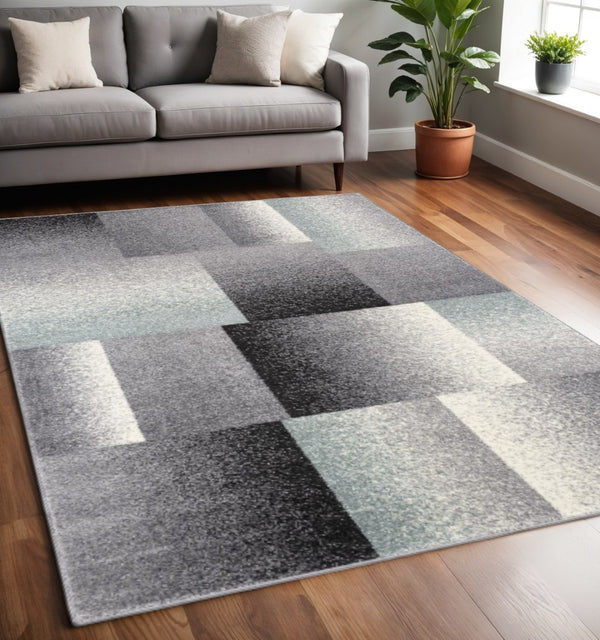 HomeRoots 4' Modern Geometric Area Rug - Stylish Charcoal and Teal Design for Contemporary Home Décor 5' X 7' Rectangle 390340