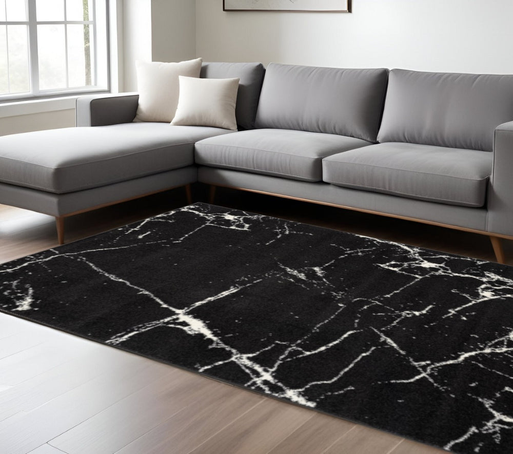 HomeRoots 7' Black and White Abstract Area Rug - Modern Marbleized Design for Cozy Living Spaces and Durability 7' X 9' 390351
