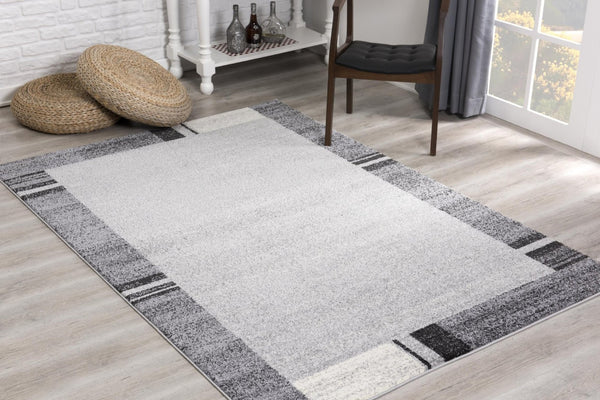 HomeRoots 4' Modern Bordered Area Rug - Elegant Dove-Gray Design for Comfort in Living, Dining, or Bedroom Spaces 8x11 390370