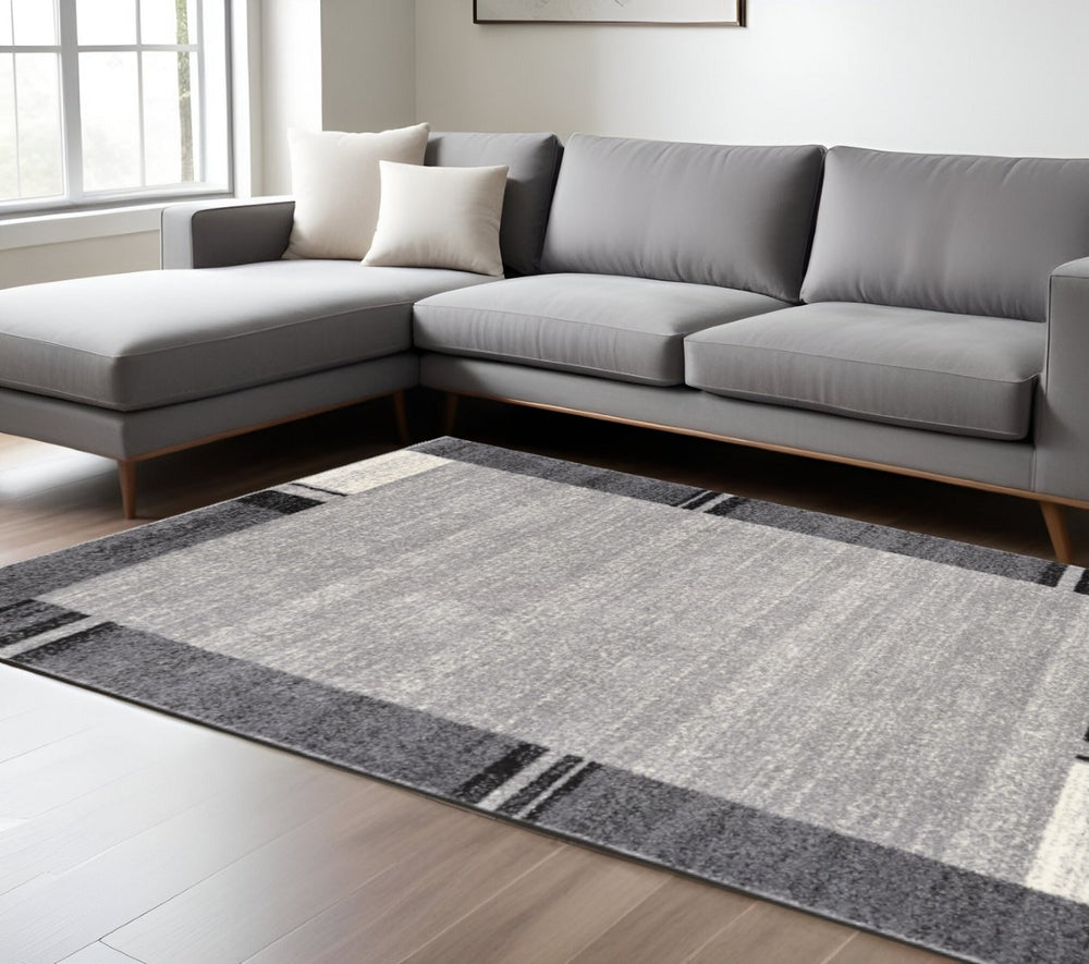 HomeRoots 4' Modern Bordered Area Rug - Elegant Dove-Gray Design for Comfort in Living, Dining, or Bedroom Spaces 8x11 390370