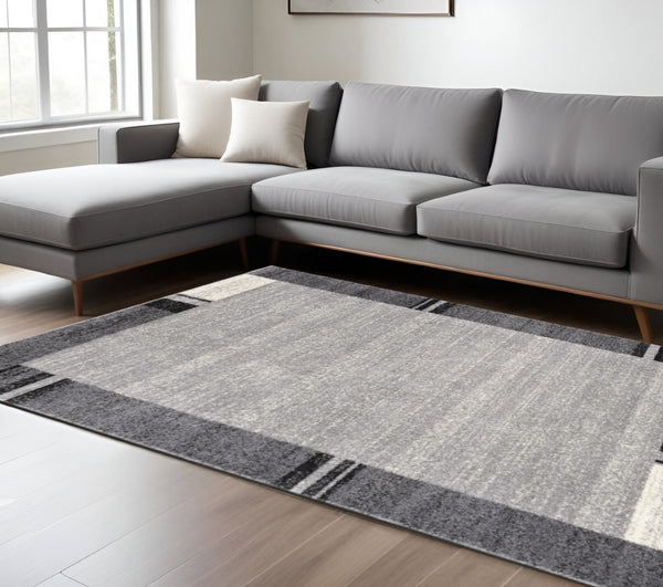 HomeRoots 4' Modern Bordered Area Rug - Elegant Dove-Gray Design for Comfort in Living, Dining, or Bedroom Spaces 8x11 390370