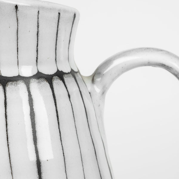 Homeroots 13" White And Black Artisan Glaze Ceramic Pitcher  Ceramic 392198