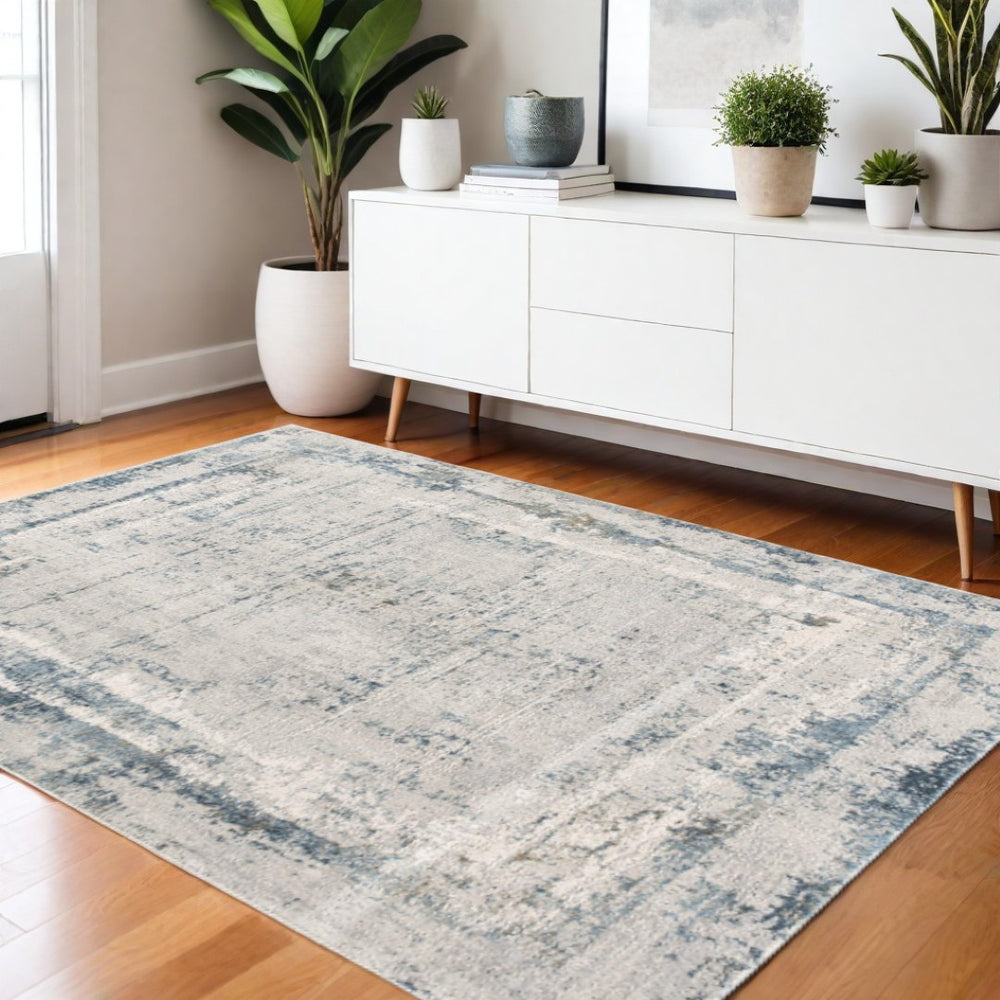 HomeRoots 4' Blue and Ivory Abstract Area Rug - Contemporary Power Loomed Design for Modern Elegance 4' X 6' 393211