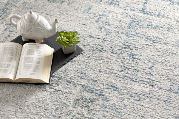 HomeRoots 4' Blue and Ivory Abstract Area Rug - Contemporary Power Loomed Design for Modern Elegance 8' X 10' 393214