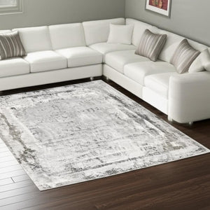 HomeRoots 4' Gray and Ivory Abstract Area Rug - Contemporary Power Loom Design for Modern Living Spaces 7' X 10' 393217