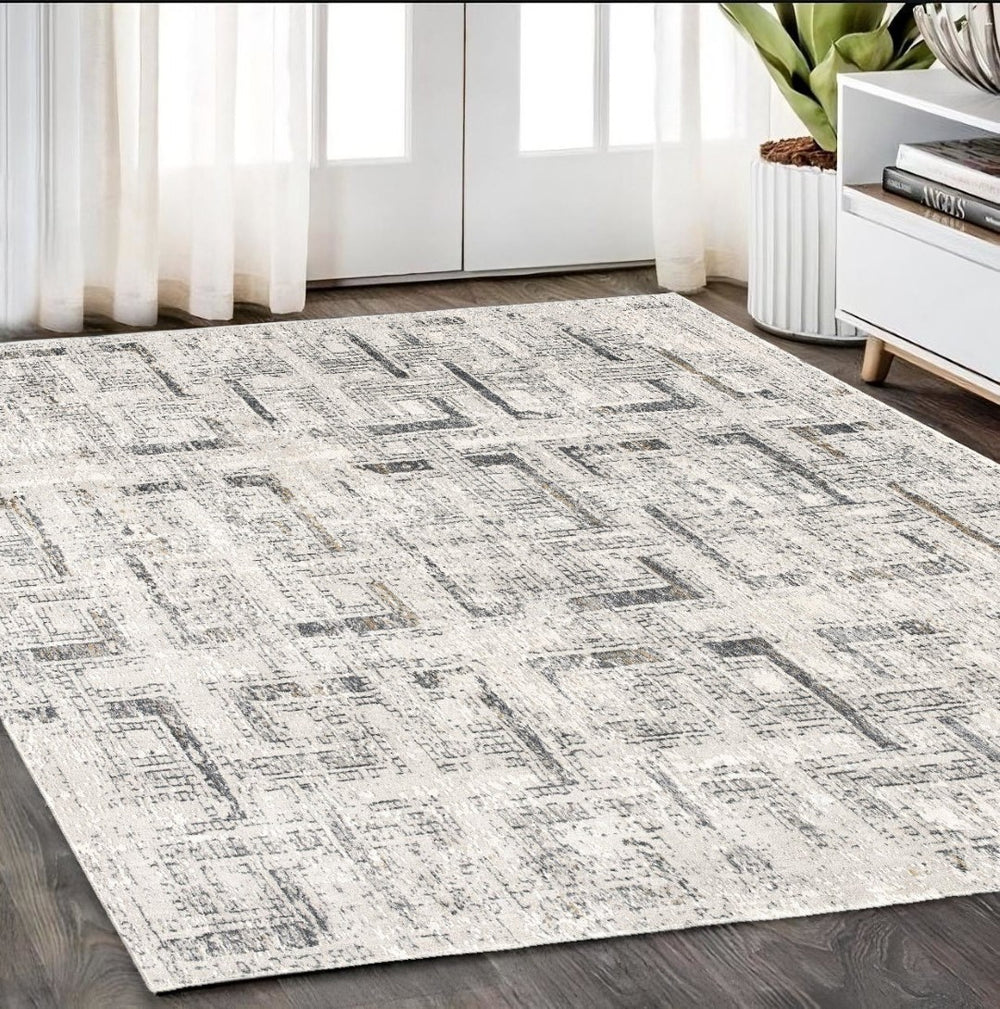 HomeRoots 4' Gray and Ivory Abstract Area Rug - Elegant Power Loomed Design for Modern Spaces and Cozy Comfort 5' X 8' 393232
