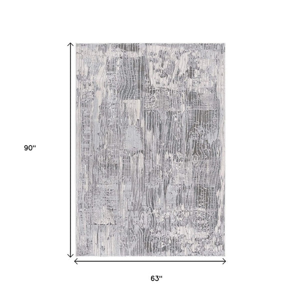 HomeRoots 10' Blue Abstract Power Loom Runner Rug - Stylish, Durable Design for High-Traffic Hallways & Entryways 5' X 7' 393528