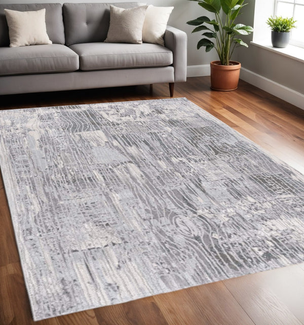 HomeRoots 10' Blue Abstract Power Loom Runner Rug - Stylish, Durable Design for High-Traffic Hallways & Entryways 5' X 7' 393528