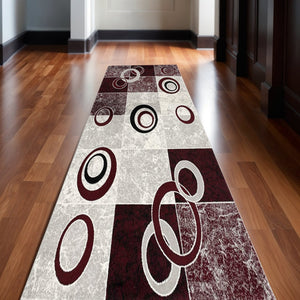 HomeRoots 10' Contemporary Red and White Abstract Runner Rug - Durable, Stain-Resistant Design for High Traffic Areas 2' x 13' 393870