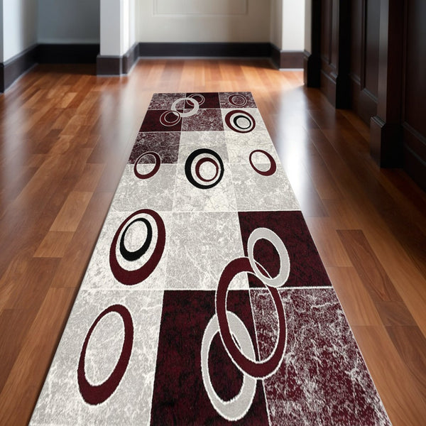 HomeRoots 10' Contemporary Red and White Abstract Runner Rug - Durable, Stain-Resistant Design for High Traffic Areas 2' x 13' 393870