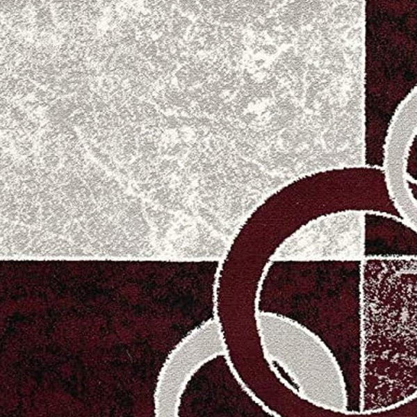 HomeRoots 10' Contemporary Red and White Abstract Runner Rug - Durable, Stain-Resistant Design for High Traffic Areas 5' X 7' 393886