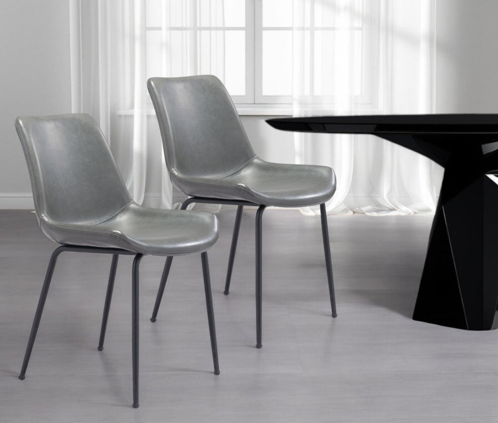 HomeRoots Set of Two Contemporary Gray Faux Leather Dining Chairs with Black Steel Legs for Versatile Use 394698