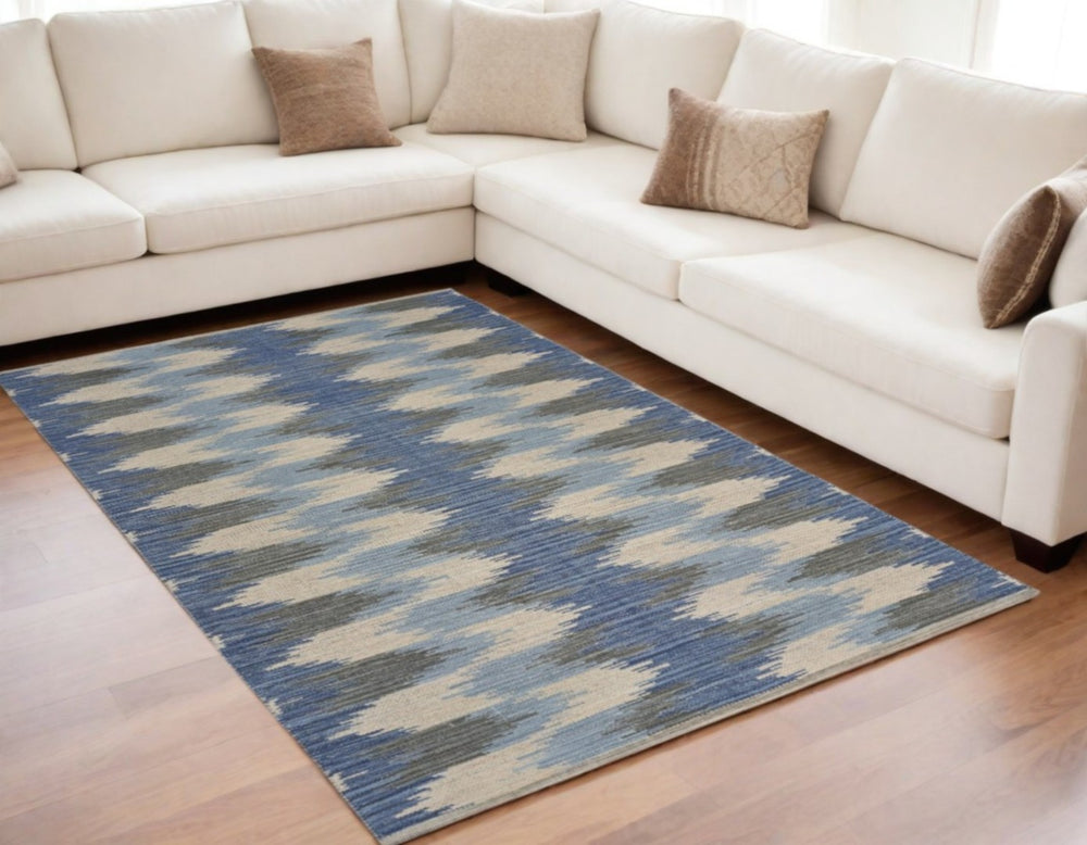 HomeRoots 5' Blue and Cream Ikat Area Rug - Handcrafted Flatweave for Modern Southwestern Charm and Comfort 5' X 7' 395479