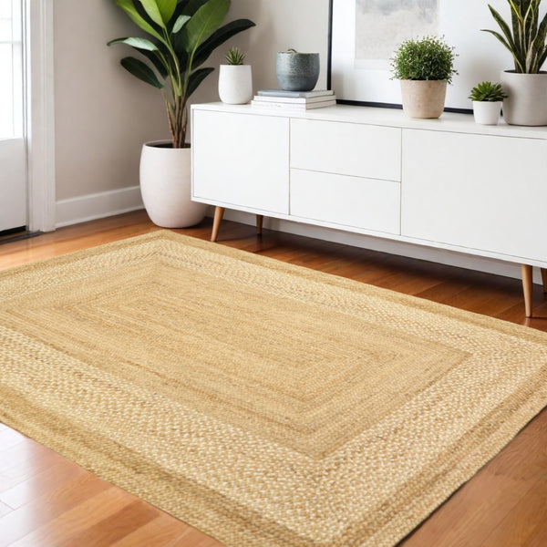 HomeRoots 4' Classic Tan Bordered Area Rug - Hand-Braided Jute, Timeless Charm for Any Home Décor Style 4' X 6' 395563