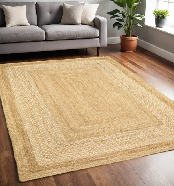 HomeRoots 4' Classic Tan Bordered Area Rug - Hand-Braided Jute, Timeless Charm for Any Home Décor Style 5' X 8' 395564