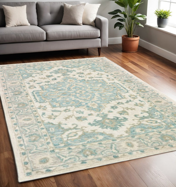 HomeRoots 5' Turquoise and Cream Medallion Area Rug - Plush, Hand-Tufted Wool Blend for Timeless Elegance 5' X 8' 395917