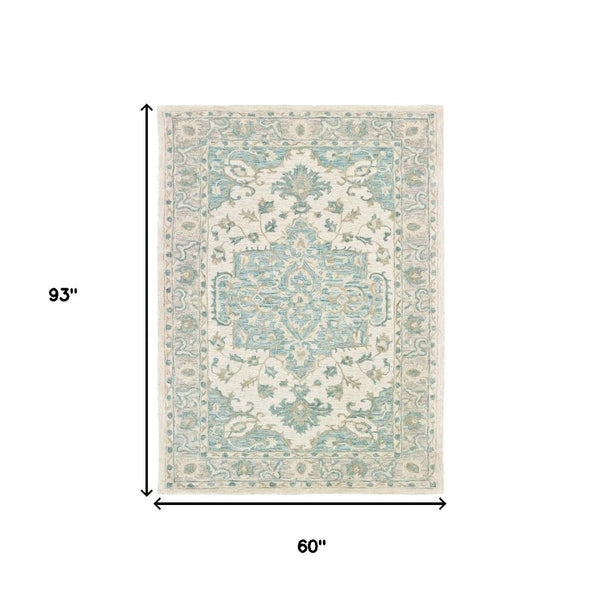 HomeRoots 5' Turquoise and Cream Medallion Area Rug - Plush, Hand-Tufted Wool Blend for Timeless Elegance 5' X 8' 395917