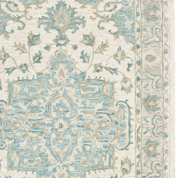 HomeRoots 5' Turquoise and Cream Medallion Area Rug - Plush, Hand-Tufted Wool Blend for Timeless Elegance 5' X 8' 395917