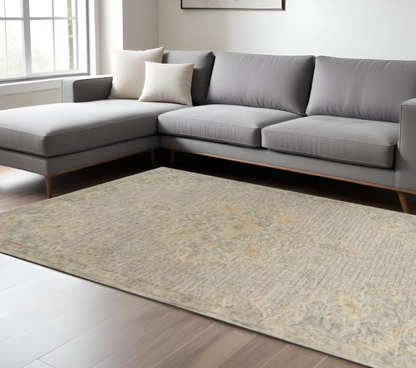 HomeRoots 9' Handwoven Beige Distressed Floral Area Rug - Vintage Charm for Living Rooms & Dining Spaces 9' X 12' 395925