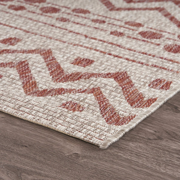 HomeRoots 8' Beige and Red Chevron Area Rug – Stylish Indoor/Outdoor Decor for Modern Living Spaces and Patios 8' x 10' 396228