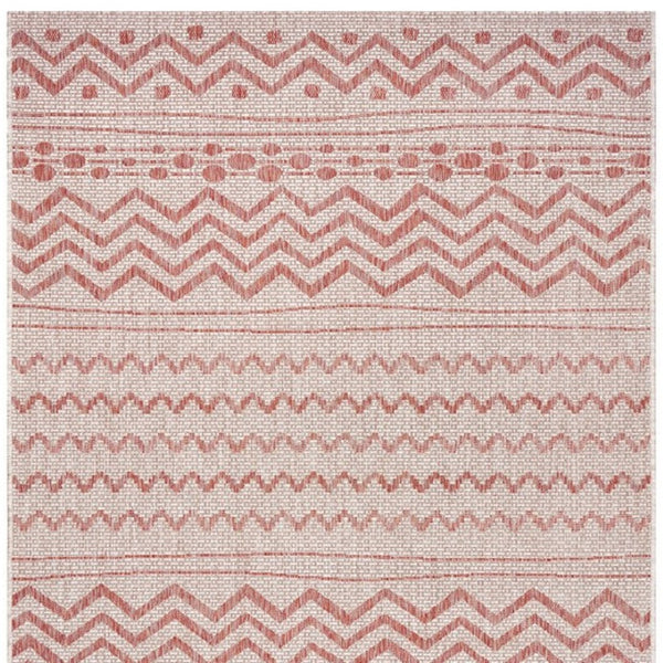 HomeRoots 8' Beige and Red Chevron Area Rug – Stylish Indoor/Outdoor Decor for Modern Living Spaces and Patios 8' x 10' 396228