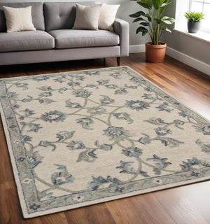 HomeRoots 5' Green Wool Hand-Tufted Rug - Timeless Elegance for Any Space, Durable, Soft, and Artisan Crafted 5' X 7' Rectangle 396274