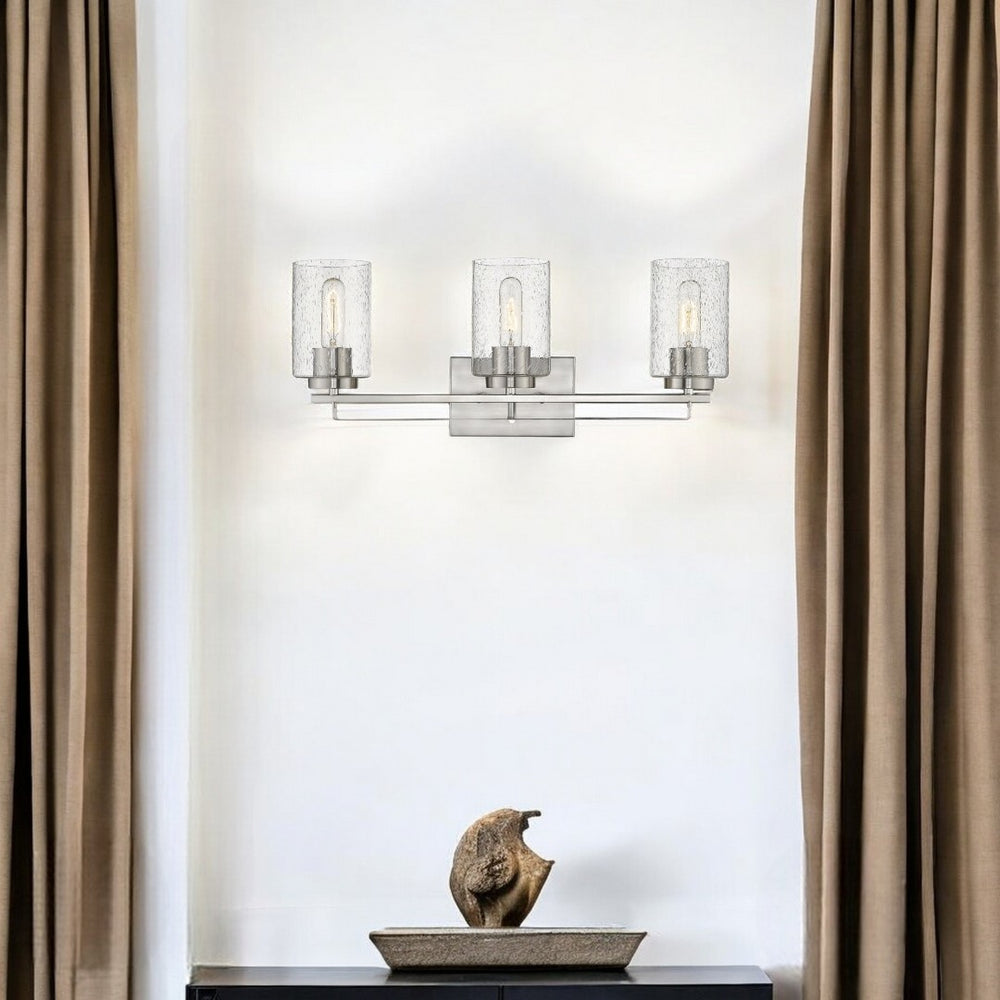 HomeRoots Silver Three-Light Wall Sconce with Textured Glass Shades for Modern Hallways, Kitchens & Living Rooms 398693