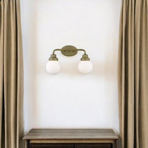 HomeRoots Two Light Gold Wall Sconce with Clear Round Glass Shades for Modern Hallways and Living Spaces 398702