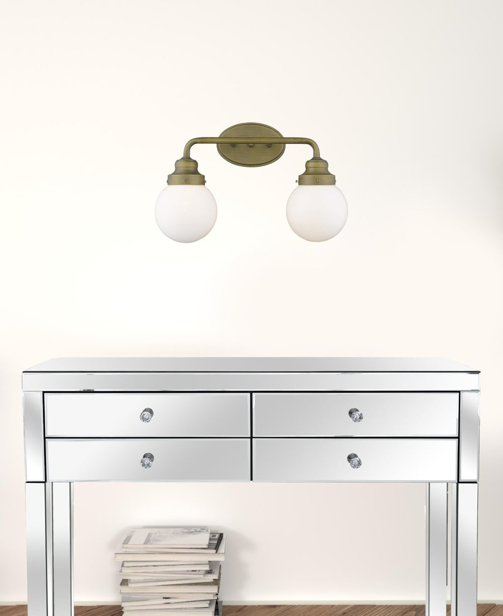 HomeRoots Two Light Gold Wall Sconce with Clear Round Glass Shades for Modern Hallways and Living Spaces 398702