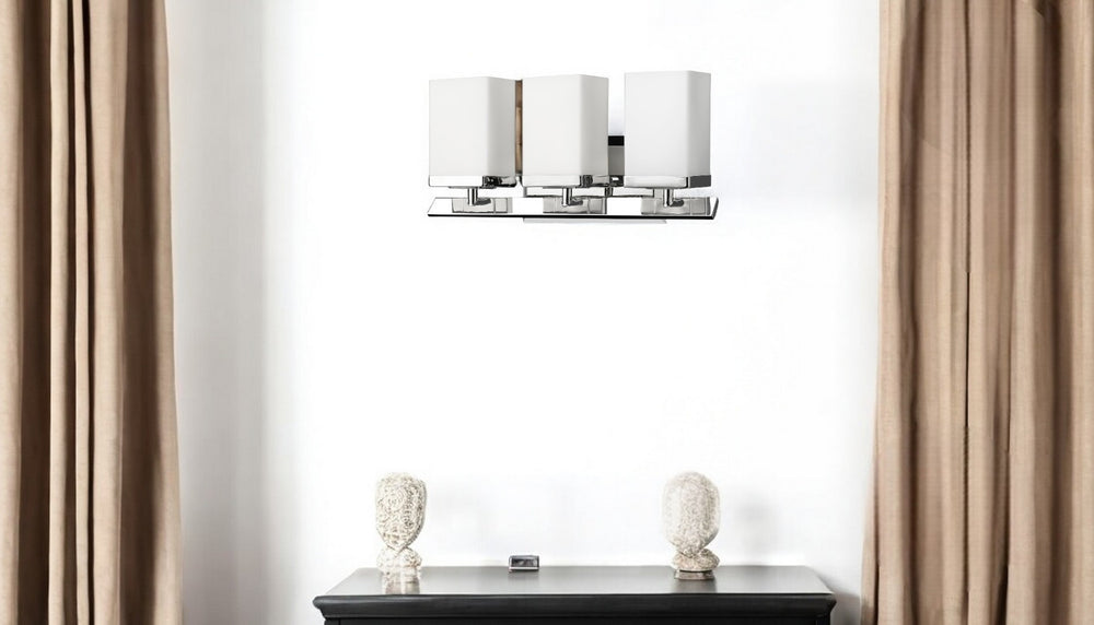 HomeRoots Three Light Silver Wall Sconce with Frosted Glass Shades – Modern Design for Ambient Illumination 398727
