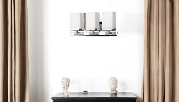HomeRoots Three Light Silver Wall Sconce with Frosted Glass Shades – Modern Design for Ambient Illumination 398727