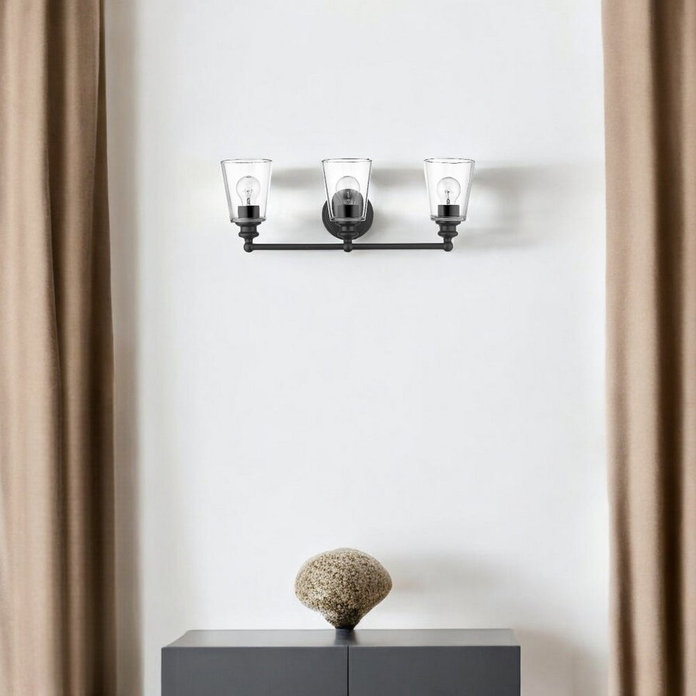 HomeRoots Three Light Matte Black Wall Sconce with Clear Glass Shades - Modern Elegance for Any Room 398763