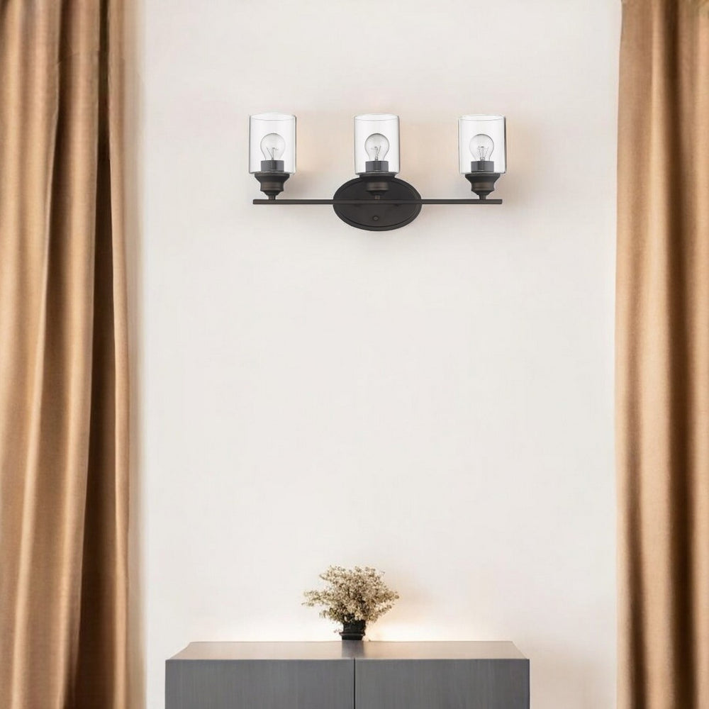 HomeRoots Three Light Bronze Wall Sconce with Clear Glass Shades – Elegant Fixture for Any Interior Space 398780