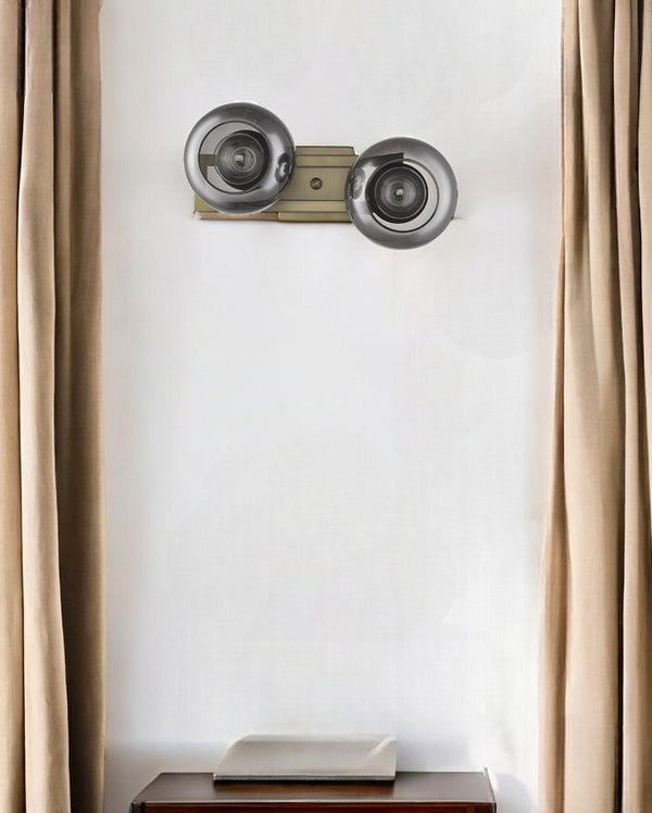 HomeRoots Lunette 2-Light Wall Sconce in Aged Brass with Smoked Glass Shades for Chic Mid-Century Decor 398789