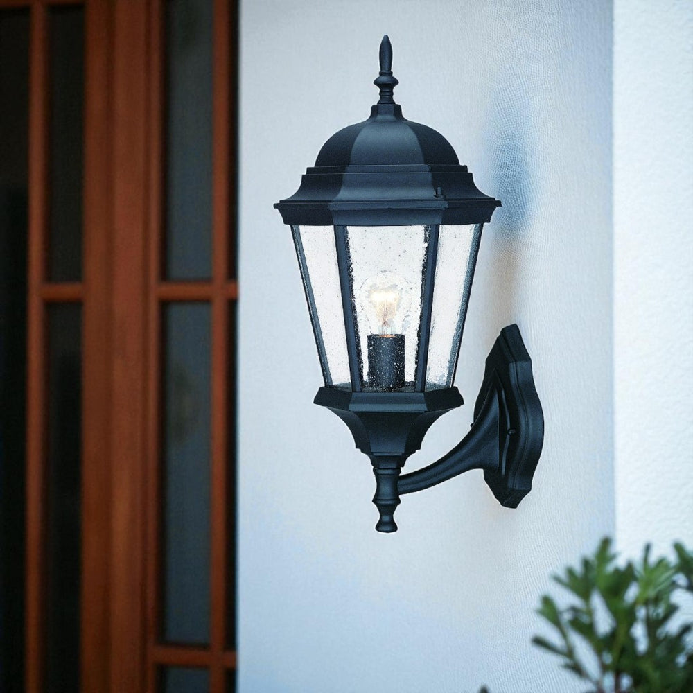 HomeRoots Matte Black Swing Arm Glass Lantern Wall Light - Elegant Outdoor Fixture with Raindrop Glass Panels 399227