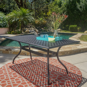 English Elm Christopher Knight Home® - CAYMAN Rectangle Table Black Cast Aluminum Outdoor Dining Table with Lattice Top, Umbrella Hole, Seats Six 56955.00