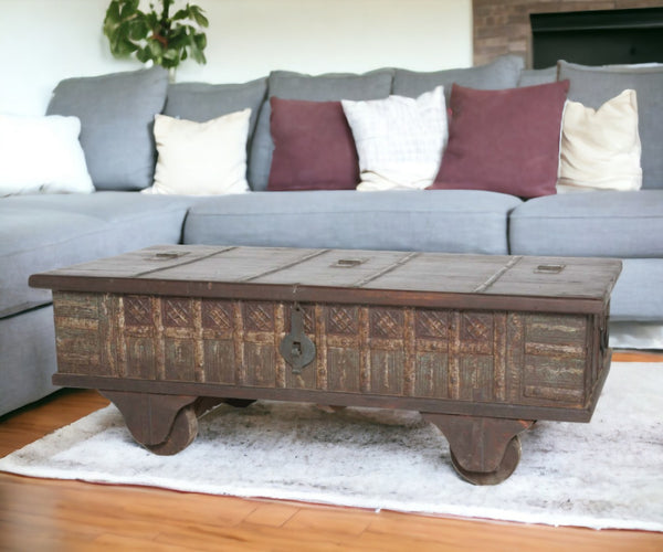 HomeRoots 50" Brown Solid Wood Lift Top Coffee Table with Hidden Storage and Rolling Casters for Versatile Use 400881