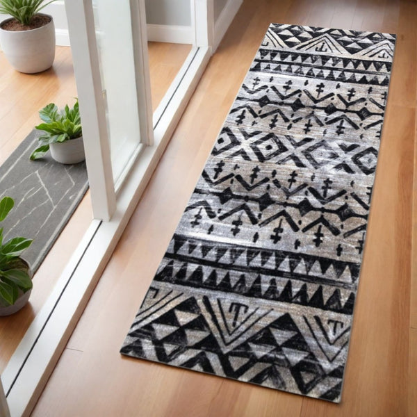 HomeRoots 2' X 6' Stylish Black and Gray Aztec Runner Rug - Washable, Durable, Skid-Resistant for High Traffic Areas 401067
