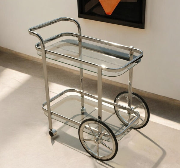 HomeRoots 28" Silver Metal and Glass Rolling Trolley Bar Cart - Stylish, Mobile Design for Modern Entertaining 401094