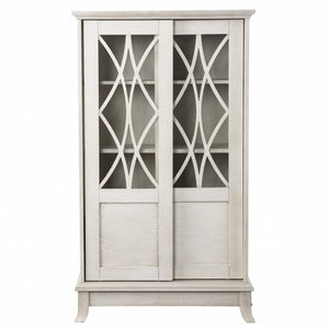 HomeRoots 28" Elegant White Accent Cabinet with Eight Shelves, Lattice Scrollwork, and Sliding Doors for Storage 401697