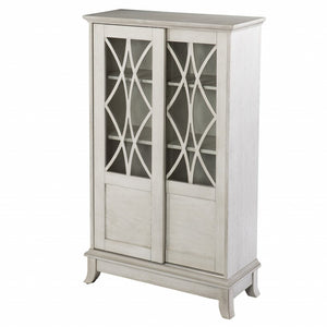 HomeRoots 28" Elegant White Accent Cabinet with Eight Shelves, Lattice Scrollwork, and Sliding Doors for Storage 401697