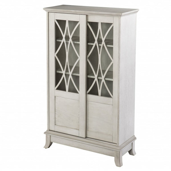 HomeRoots 28" Elegant White Accent Cabinet with Eight Shelves, Lattice Scrollwork, and Sliding Doors for Storage 401697