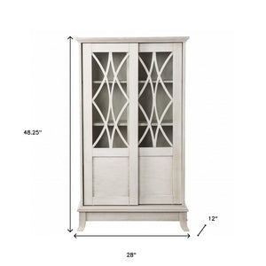 HomeRoots 28" Elegant White Accent Cabinet with Eight Shelves, Lattice Scrollwork, and Sliding Doors for Storage 401697
