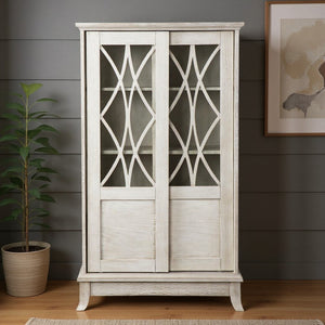 HomeRoots 28" Elegant White Accent Cabinet with Eight Shelves, Lattice Scrollwork, and Sliding Doors for Storage 401697