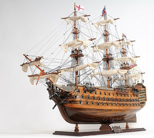 HomeRoots 27" Hand-Painted Solid Wood Model Boat Sculpture - Nautical Charm for Home Décor & Collectors 401842