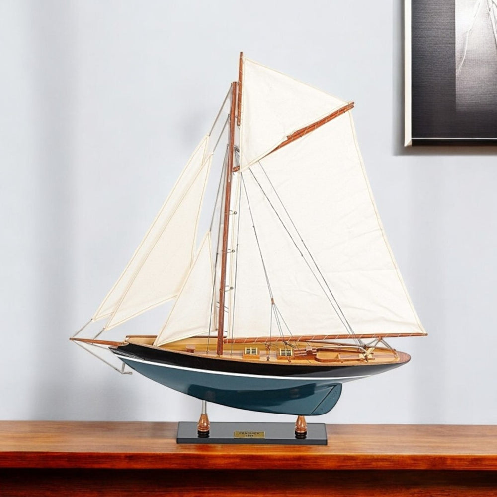 HomeRoots 31" Hand-Painted Solid Wood Pen Duick Model Sailboat – Vintage Nautical Decor for Any Space 402009