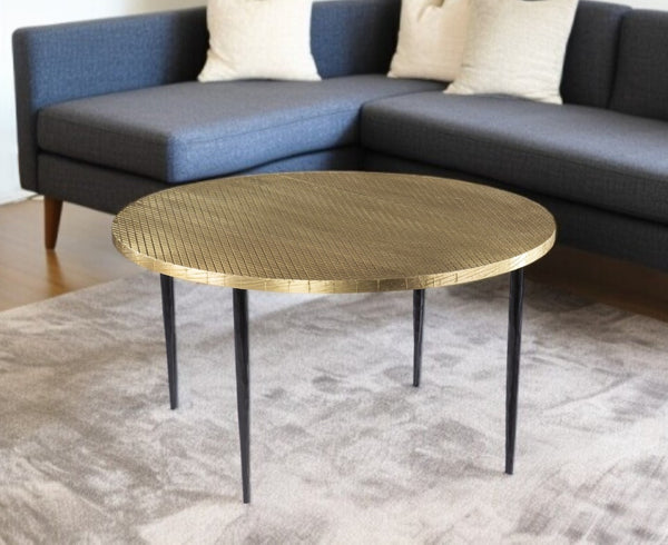 HomeRoots 34" Bold Black and Gold Embossed Round Coffee Table - Handcrafted Industrial Design for Modern Spaces 402118