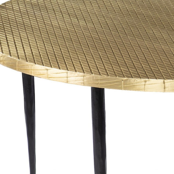 HomeRoots 34" Bold Black and Gold Embossed Round Coffee Table - Handcrafted Industrial Design for Modern Spaces 402118